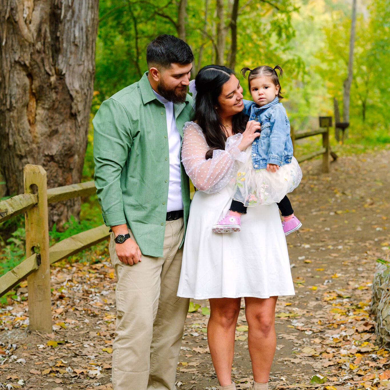 Cedar Creek Park Family Portrait Session 5 Couple posing on a wooden bridge at Cedar Creek Park during an engagement photography session